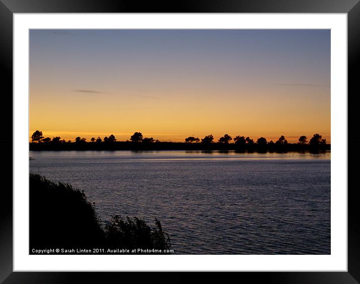 Sunset across a lake Framed Mounted Print by Sarah Osterman