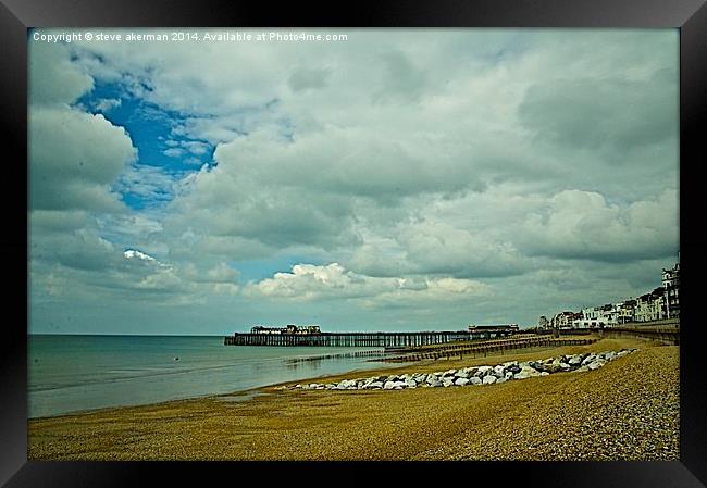 Hastings pier waiting for storms Framed Print by steve akerman