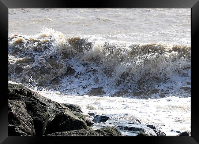 Foam figures in the surf Framed Print by Nicky Vines