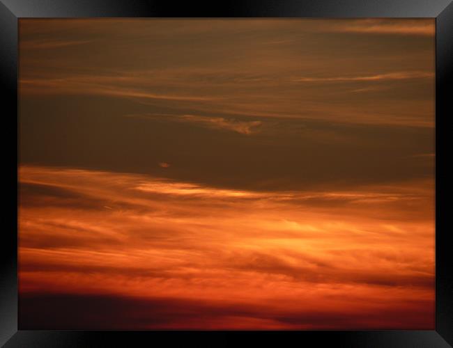 sunset clouds Framed Print by nigel watson