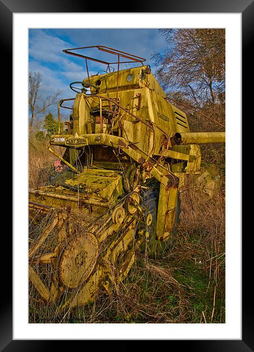 retired combine harvester Framed Mounted Print by Jo Beerens