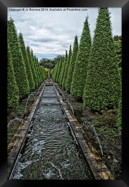 conifer lined water feature Framed Print by Jo Beerens