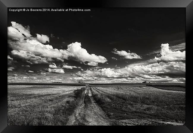 drifting clouds Framed Print by Jo Beerens