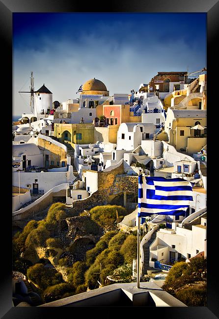 Oia and a greek flag Framed Print by meirion matthias