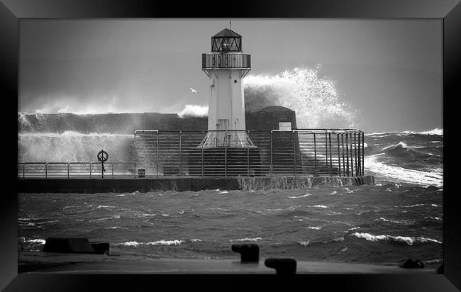 Ardrossan Lighthouse Versus the Sea Framed Print by Fiona Messenger