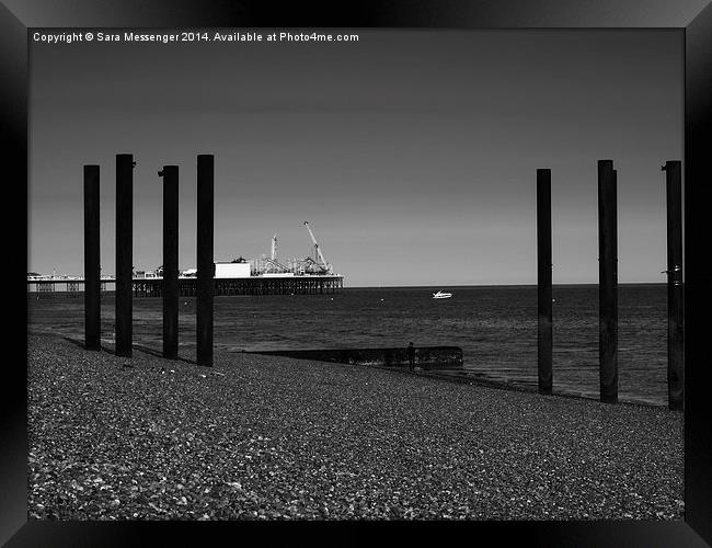 Pier-ing through the struts  Framed Print by Sara Messenger