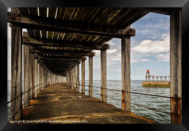 Underneath Whitby Pier Framed Print by Chris Frost