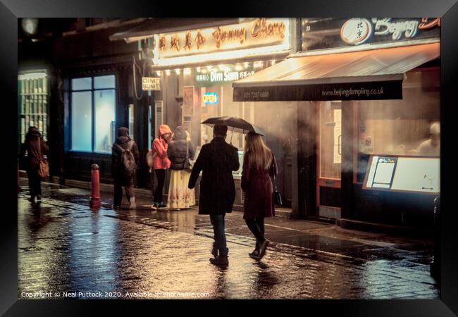 Rainy Night in Soho Framed Print by Neal P