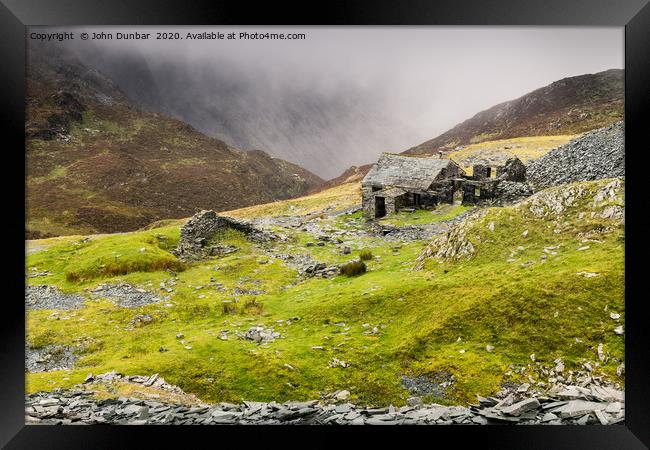 Feeling the weather at Dubs Hut Framed Print by John Dunbar