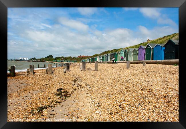 Beach Huts on the Hampshire coast in the South of England Framed Print by Michael Harper
