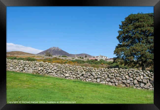 A dry stone wall and mountain peaks n the world fa Framed Print by Michael Harper