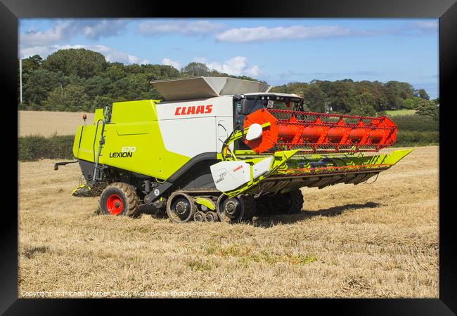 A Cllaas lexion 570 Combine Harvester  Framed Print by Michael Harper
