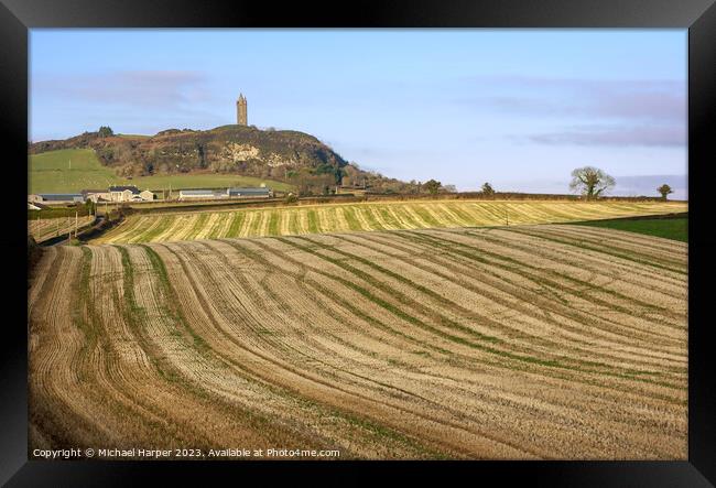 Scrabo Tower on Scrabo Hill overlooking harvested farm fields on Framed Print by Michael Harper