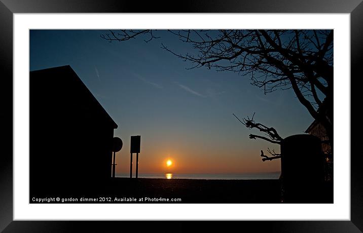 Sunrise and silhouettes at Calshot Framed Mounted Print by Gordon Dimmer