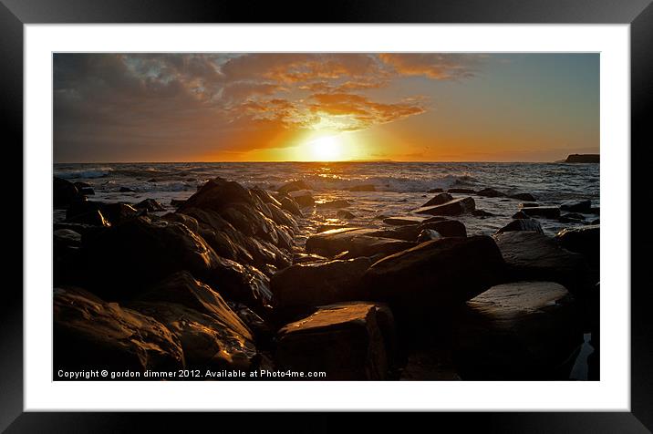 A vivid kimmeridge sunset Framed Mounted Print by Gordon Dimmer