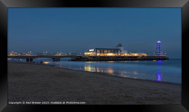 Bournemouth Pier at night Framed Print by Paul Brewer