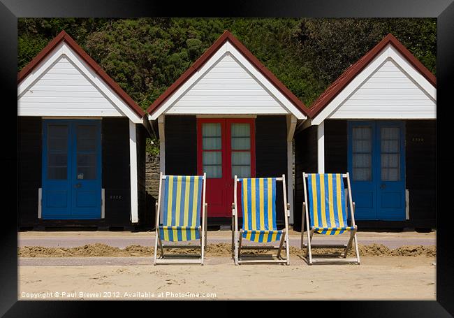 Beach Huts and Deck chairs Framed Print by Paul Brewer