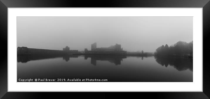 Caerphilly Castle on a misty gloomy day Framed Mounted Print by Paul Brewer