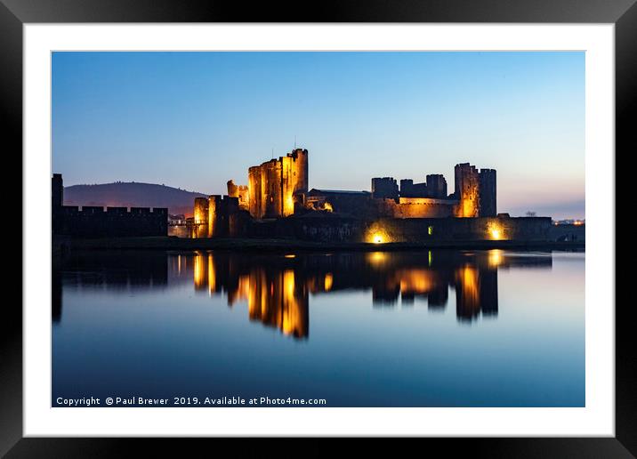 Caerphilly Castle at night in winter Framed Mounted Print by Paul Brewer