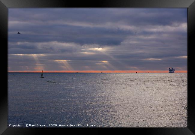 stormy skies over the sea off Sandbanks Framed Print by Paul Brewer