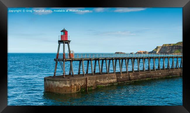 Whitby East Lighthouse and jetty, North Yorkshire Framed Print by Greg Marshall