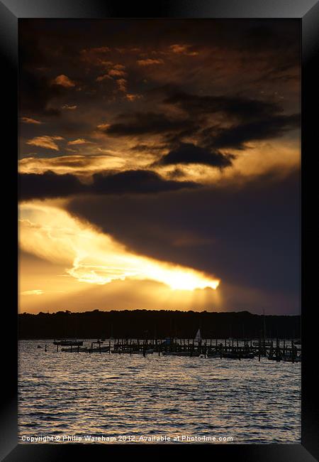 Sun and Cloud over Brownsea Framed Print by Phil Wareham