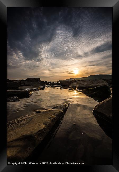Sunset over a rock pool Framed Print by Phil Wareham