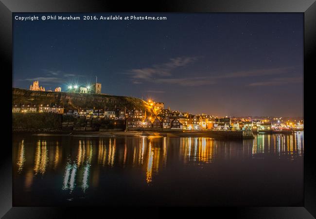 Whitby at Night Framed Print by Phil Wareham