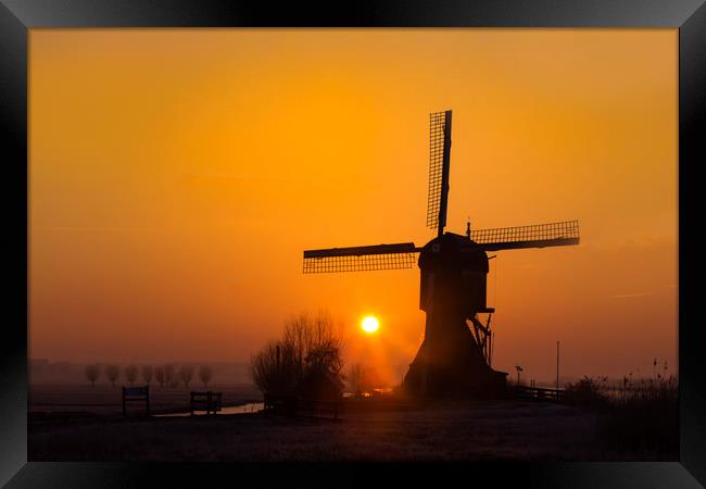 Warm sunrise on the Kinderdijk windmill in Rotterd Framed Print by Ankor Light