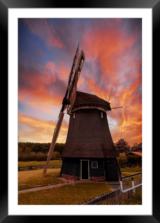 Vivid red and orange color sunset over a Dutch win Framed Mounted Print by Ankor Light