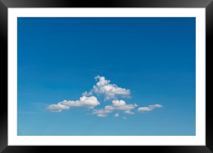 Group of clouds floating in the blue cyan sky Framed Mounted Print by Ankor Light