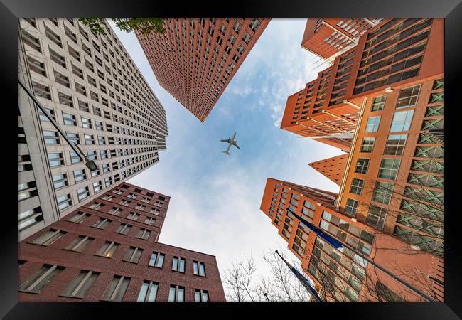 A plane flying over the headquarters and modern br Framed Print by Ankor Light