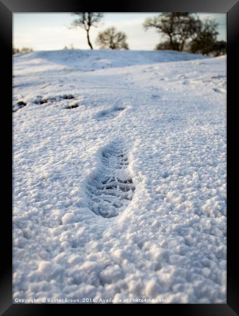 Footstep in the Snow Framed Print by Buster Brown