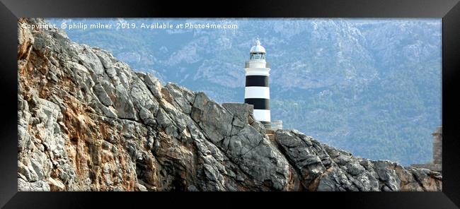 Lighthouse on the cliffs Framed Print by philip milner