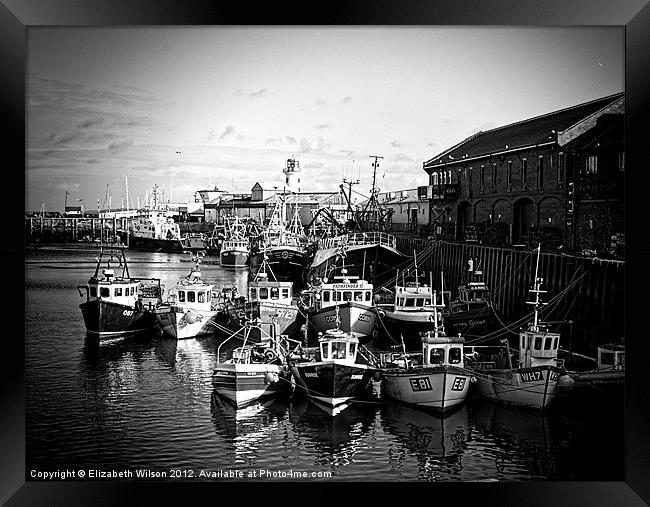 Boats Resting In The Harbour in Black and White Framed Print by Elizabeth Wilson-Stephen