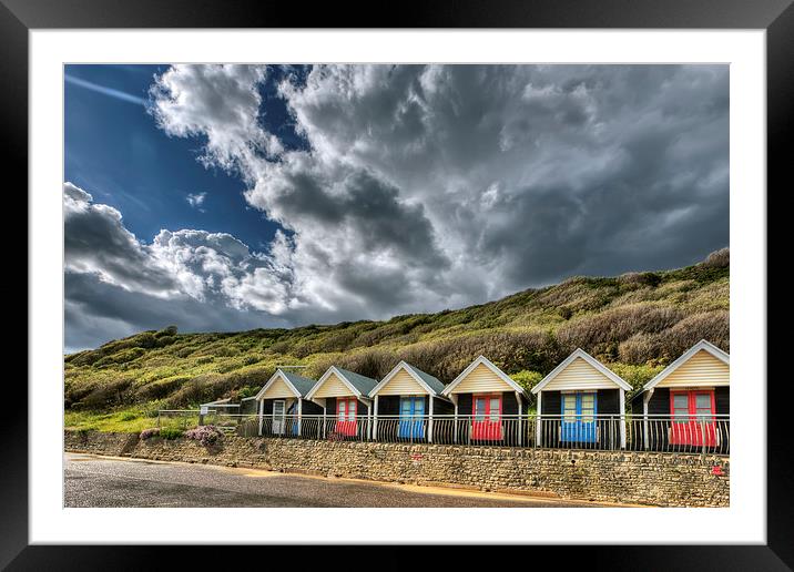 Clouds, beach huts and light Framed Mounted Print by Jennie Franklin