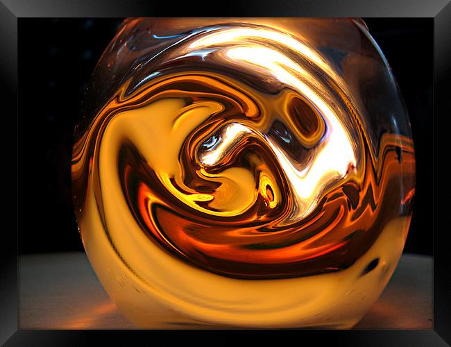 Warm Swirly globe on desk Framed Print by sean walters