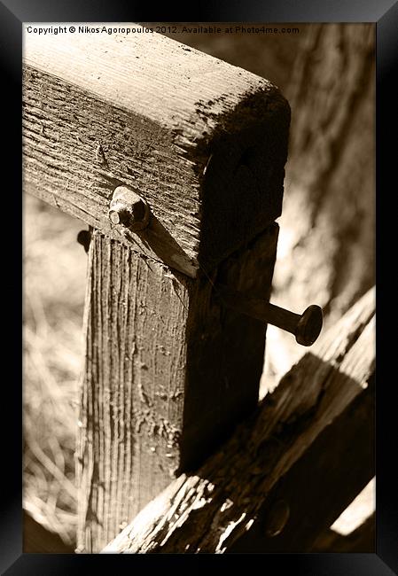 Metal bolts on timber posts Framed Print by Alfani Photography