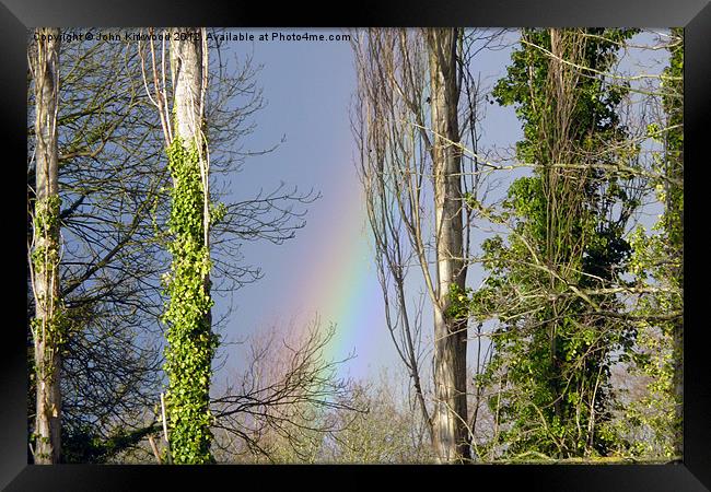 Rainbow through the Trees Framed Print by John Kirkwood
