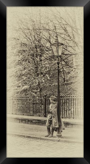 Leaning on a lamp post. Framed Print by Alan Matkin