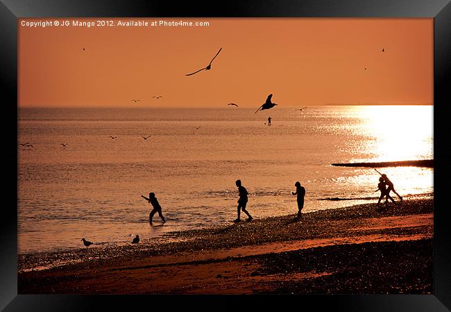 Boys Playing in Sunset Framed Print by JG Mango