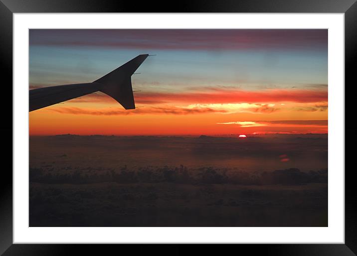A Sunset from the porthole of a plane I was flying Framed Mounted Print by JEAN FITZHUGH