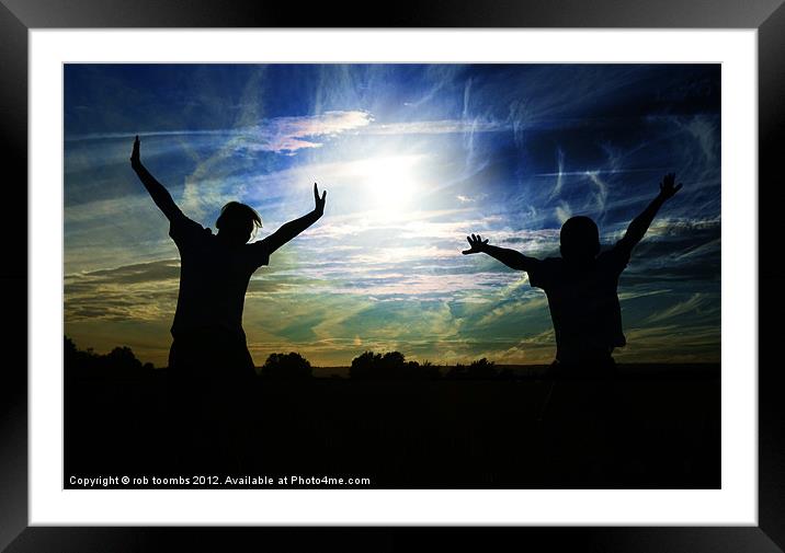 A JOYFUL SILHOUETTE Framed Mounted Print by Rob Toombs