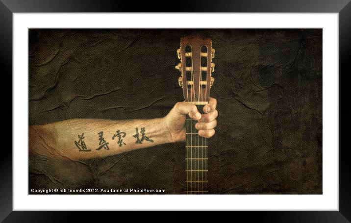 GRIPPING STRINGS Framed Mounted Print by Rob Toombs