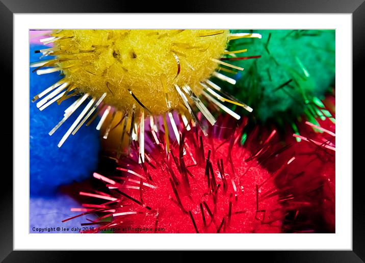 Tinsel coloured pompoms. Framed Mounted Print by Lee Daly