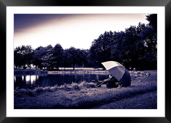 fisherman under parasol Framed Mounted Print by Lee Daly