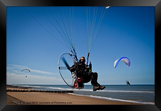 Paraglider in flight. Framed Print by Lee Daly