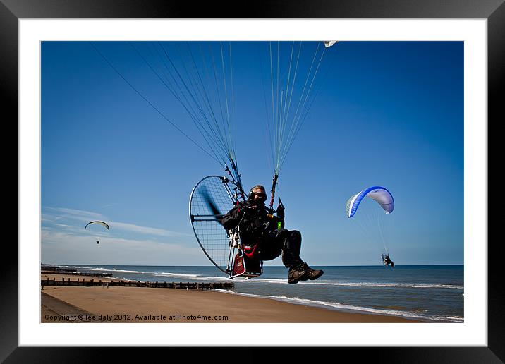 Paraglider in flight. Framed Mounted Print by Lee Daly