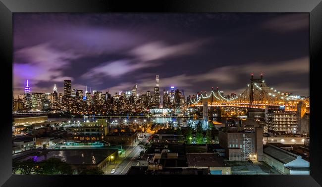 Manhattan Skyline at Night Framed Print by Paul Mirfin