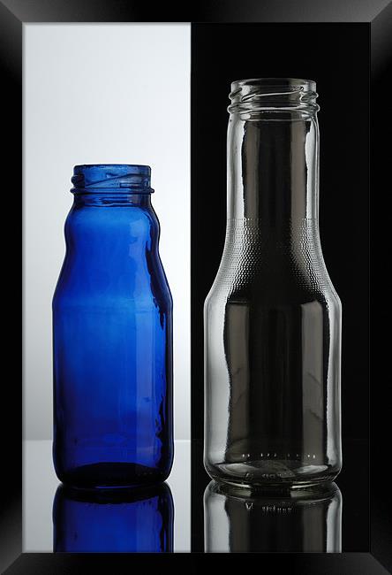 Glass bottles. Transparent over black, blue over w Framed Print by Josep M Peñalver